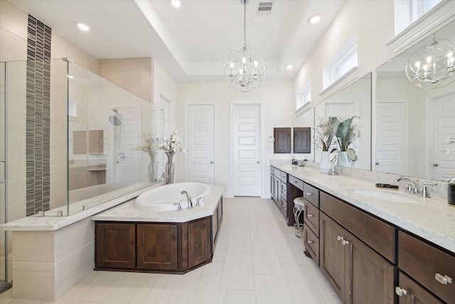190 Monarch Trl, Sugar Land, TX 77498 - bathroom with a chandelier, a shower stall, a bath, double vanity, and recessed lighting