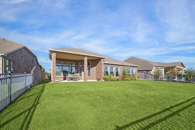 190 Monarch Trl, Sugar Land, TX 77498 - back of property featuring brick siding, a patio area, and a fenced backyard