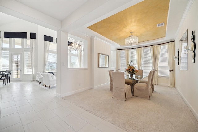 190 Monarch Trl, Sugar Land, TX 77498 - dining area with a chandelier, light carpet, light tile patterned floors, and a tray ceiling