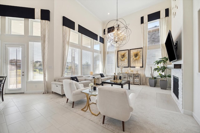 190 Monarch Trl, Sugar Land, TX 77498 - carpeted living area featuring a towering ceiling, a chandelier, and a fireplace