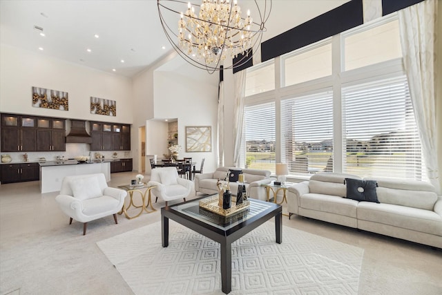 190 Monarch Trl, Sugar Land, TX 77498 - living room with a high ceiling, a chandelier, light carpet, and recessed lighting