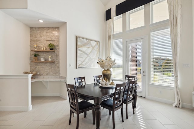 190 Monarch Trl, Sugar Land, TX 77498 - dining room featuring a towering ceiling and light tile patterned floors