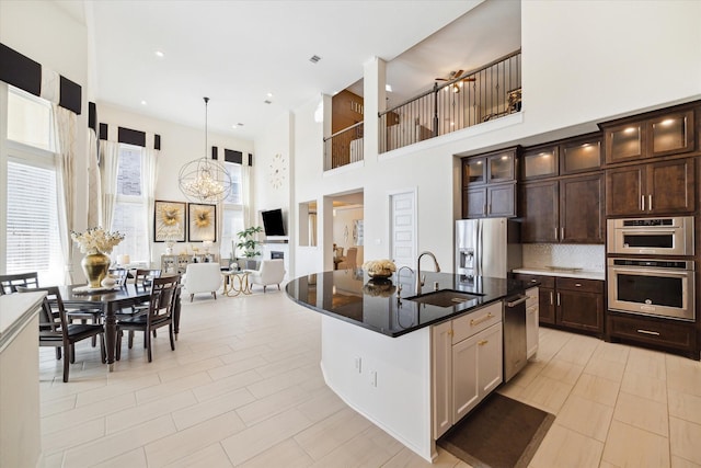 190 Monarch Trl, Sugar Land, TX 77498 - kitchen with a towering ceiling, stainless steel appliances, glass insert cabinets, dark brown cabinetry, and decorative backsplash