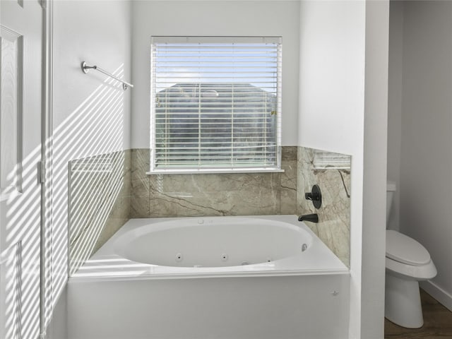 5031 Rustling Branch Ln, Katy, TX 77449 - full bath featuring healthy amount of natural light and a whirlpool tub