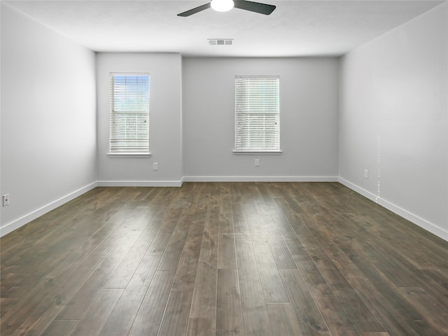 5031 Rustling Branch Ln, Katy, TX 77449 - spare room with ceiling fan and dark wood-type flooring
