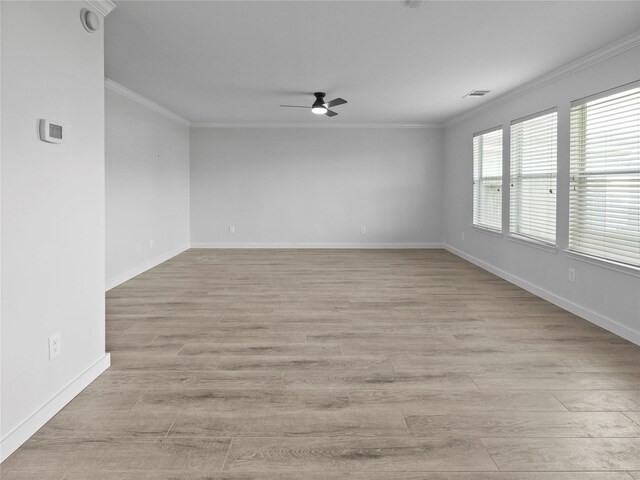 5031 Rustling Branch Ln, Katy, TX 77449 - spare room with ceiling fan, ornamental molding, light wood finished floors, and a smoke detector