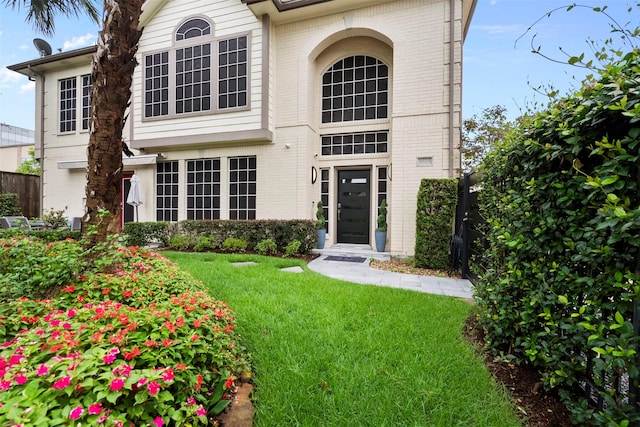 5603 Dolores St, Houston, TX 77057 - view of front of house with brick siding and a front lawn