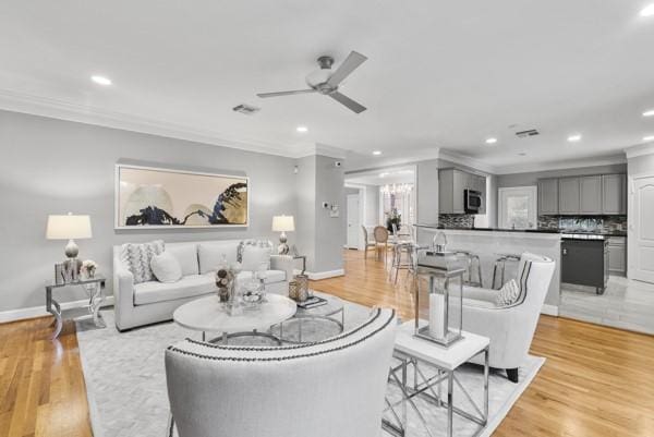 5603 Dolores St, Houston, TX 77057 - living room with crown molding, a ceiling fan, recessed lighting, and light wood-type flooring