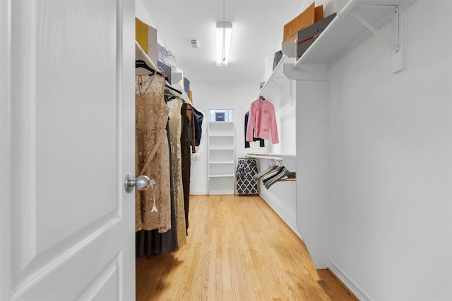 5603 Dolores St, Houston, TX 77057 - walk in closet with light wood-style floors