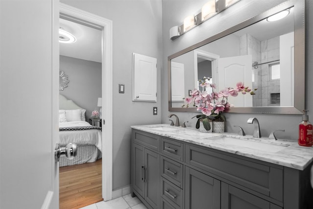 5603 Dolores St, Houston, TX 77057 - full bath with double vanity, connected bathroom, and tiled shower