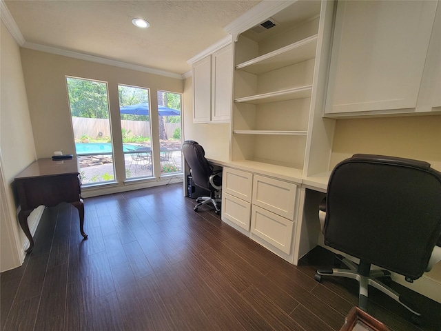 711 Holly Springs Dr, Conroe, TX 77302 - office space featuring crown molding, built in desk, dark wood finished floors, and recessed lighting