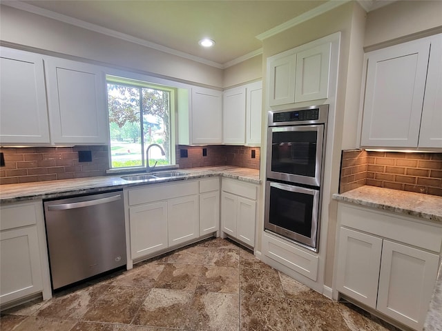 711 Holly Springs Dr, Conroe, TX 77302 - kitchen featuring stainless steel appliances, crown molding, backsplash, white cabinetry, and recessed lighting