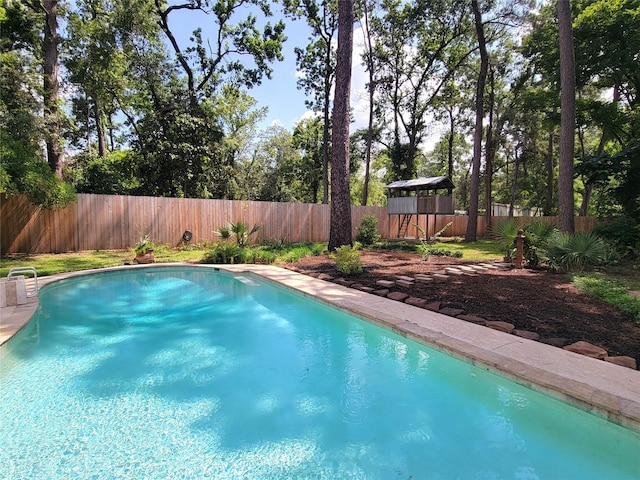 711 Holly Springs Dr, Conroe, TX 77302 - view of swimming pool featuring a fenced backyard
