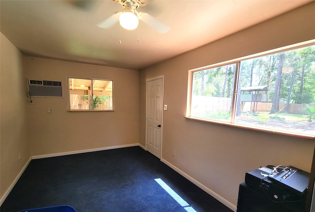 711 Holly Springs Dr, Conroe, TX 77302 - spare room with ceiling fan, a wall mounted air conditioner, and dark colored carpet