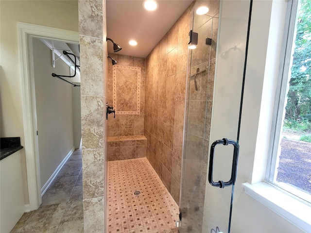 711 Holly Springs Dr, Conroe, TX 77302 - bathroom with a shower stall, recessed lighting, and stone finish floors