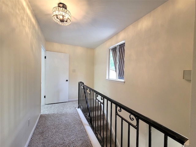 711 Holly Springs Dr, Conroe, TX 77302 - corridor with an upstairs landing, carpet, and a chandelier