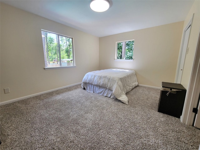 711 Holly Springs Dr, Conroe, TX 77302 - carpeted bedroom featuring baseboards