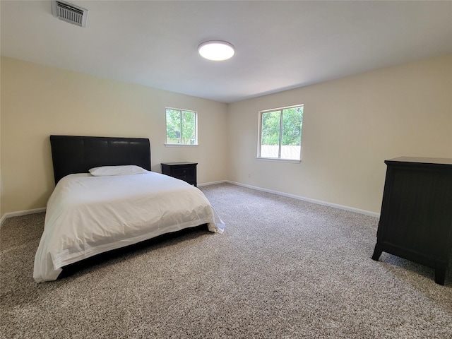 711 Holly Springs Dr, Conroe, TX 77302 - carpeted bedroom with baseboards