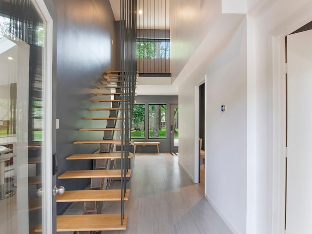 2812 Crossvine, The Woodlands, TX 77380 - staircase with baseboards and a high ceiling