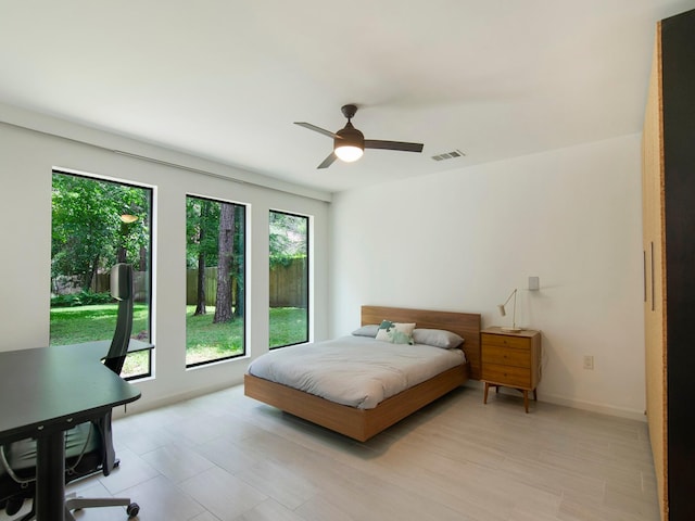 2812 Crossvine, The Woodlands, TX 77380 - bedroom featuring baseboards and ceiling fan