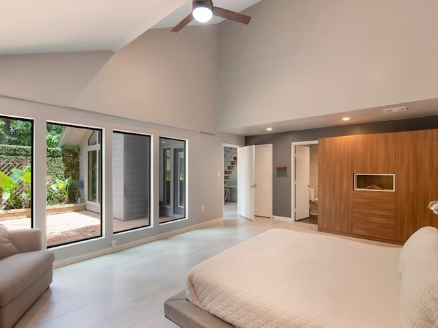 2812 Crossvine, The Woodlands, TX 77380 - bedroom with high vaulted ceiling, light wood finished floors, recessed lighting, ensuite bath, and access to exterior