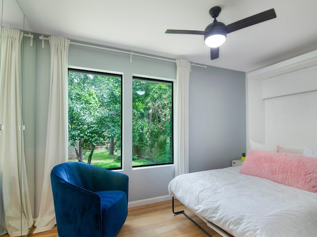 2812 Crossvine, The Woodlands, TX 77380 - bedroom featuring light wood finished floors and ceiling fan