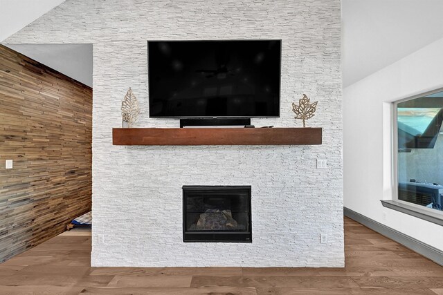 10102 Hooke Dr, Iowa Colony, TX 77583 - detailed view of wood finished floors and a stone fireplace