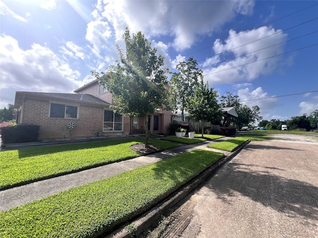 8323 E Ridge Dr, Houston, TX 77040 - view of front of home with brick siding and a front lawn