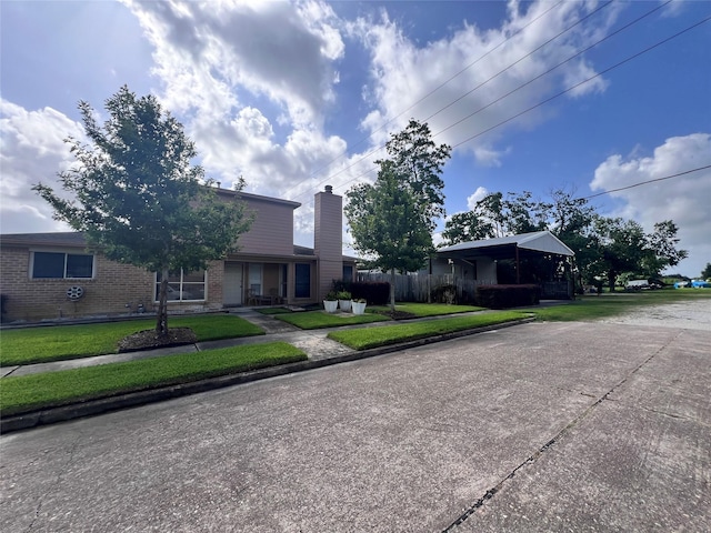 8323 E Ridge Dr, Houston, TX 77040 - view of front of house featuring brick siding and a chimney