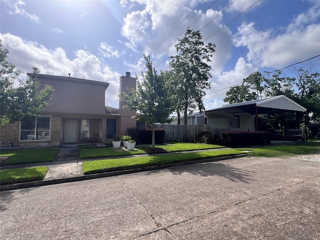 8323 E Ridge Dr, Houston, TX 77040 - view of front of home with brick siding and a chimney