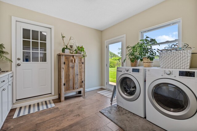 11320 Cedar Gully Rd, Beach City, TX 77523 - washroom featuring washer and clothes dryer and light wood finished floors