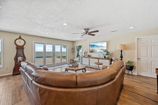 11320 Cedar Gully Rd, Beach City, TX 77523 - living area with a textured ceiling, wood finished floors, a ceiling fan, and recessed lighting