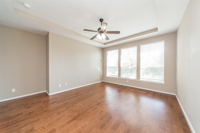 18219 S Austin Shore Dr, Cypress, TX 77433 - unfurnished room with a raised ceiling, wood finished floors, ceiling fan, and a smoke detector
