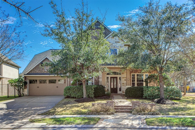 18219 S Austin Shore Dr, Cypress, TX 77433 - view of property hidden behind natural elements featuring french doors, stone siding, driveway, brick siding, and an attached garage