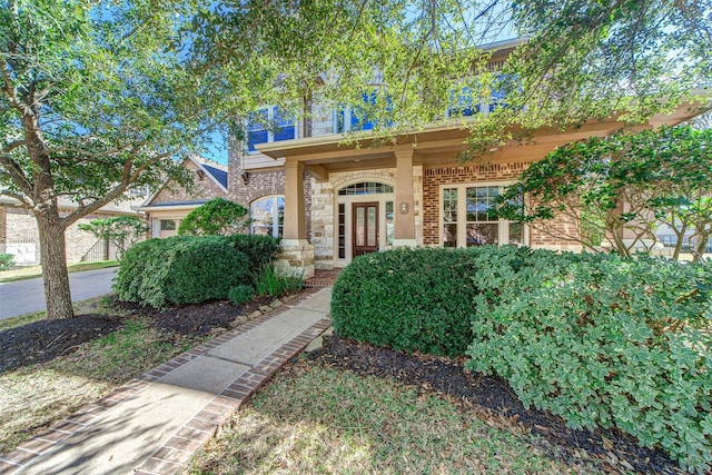 18219 S Austin Shore Dr, Cypress, TX 77433 - view of front facade featuring stone siding, french doors, and brick siding