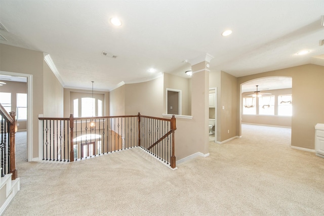 18219 S Austin Shore Dr, Cypress, TX 77433 - hallway featuring carpet floors, crown molding, healthy amount of natural light, recessed lighting, and arched walkways