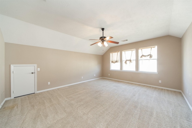 18219 S Austin Shore Dr, Cypress, TX 77433 - empty room featuring vaulted ceiling, a ceiling fan, and light carpet