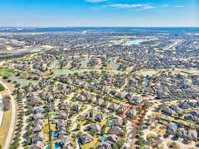 18219 S Austin Shore Dr, Cypress, TX 77433 - aerial overview of property's location with property parcel outlined, nearby suburban area, and a large body of water