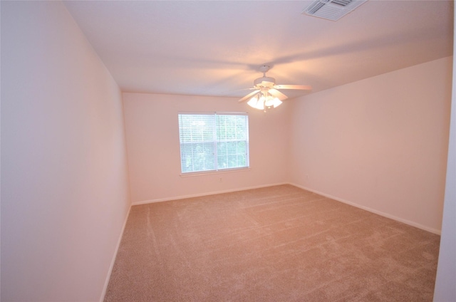 6906 Grant Dr, Magnolia, TX 77354 - empty room featuring light carpet and ceiling fan