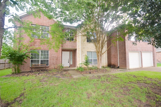 6906 Grant Dr, Magnolia, TX 77354 - view of front of property with concrete driveway, an attached garage, a front lawn, and brick siding
