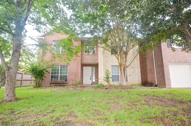6906 Grant Dr, Magnolia, TX 77354 - view of front of property featuring an attached garage and brick siding