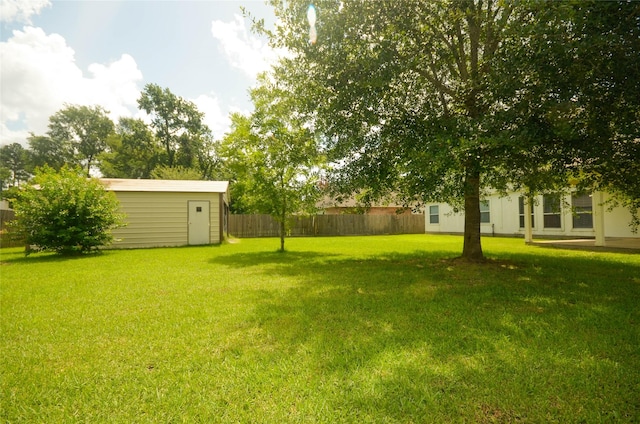 6906 Grant Dr, Magnolia, TX 77354 - view of yard featuring a storage shed
