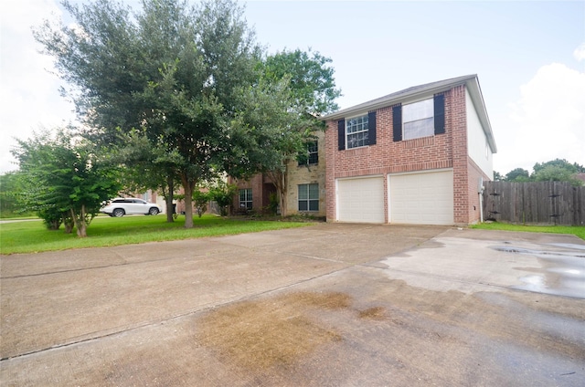 6906 Grant Dr, Magnolia, TX 77354 - view of front of house with brick siding, an attached garage, and driveway