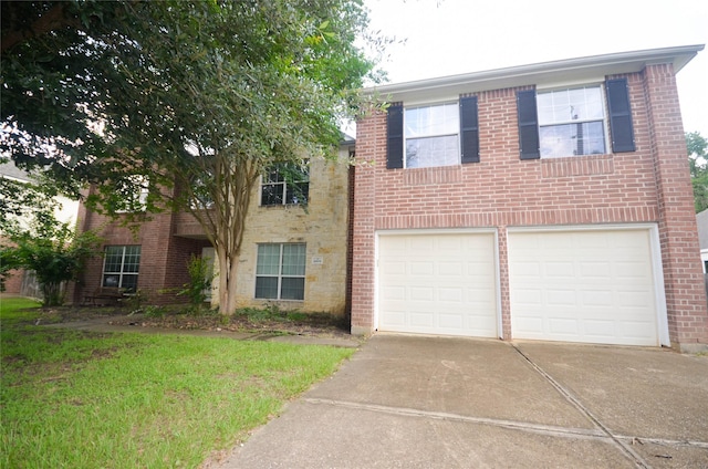 6906 Grant Dr, Magnolia, TX 77354 - view of front of property with an attached garage, concrete driveway, and brick siding