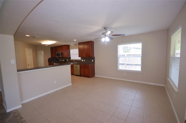 6906 Grant Dr, Magnolia, TX 77354 - kitchen with appliances with stainless steel finishes, dark countertops, healthy amount of natural light, ceiling fan, and recessed lighting