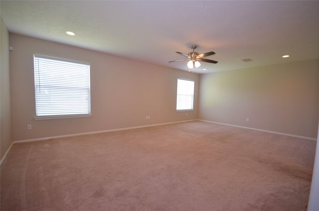 6906 Grant Dr, Magnolia, TX 77354 - empty room with light carpet, a ceiling fan, and recessed lighting