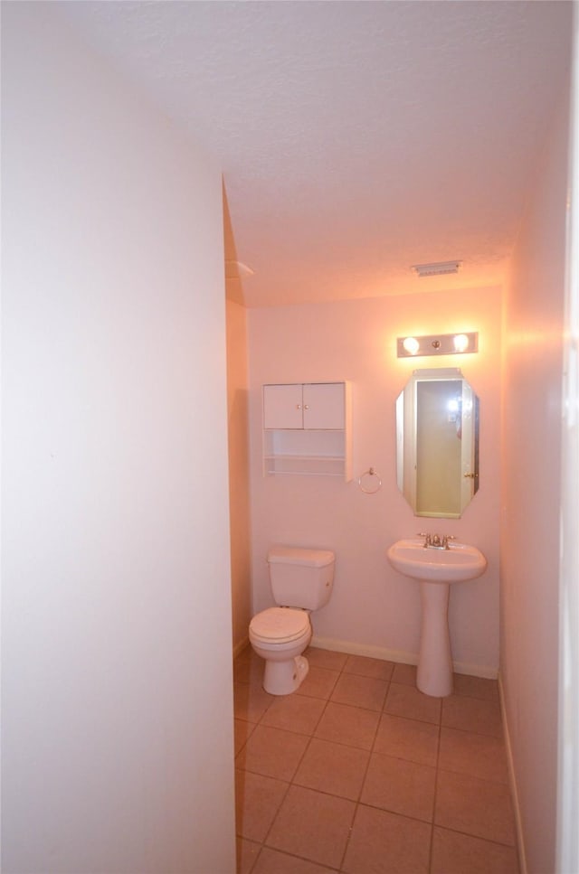 6906 Grant Dr, Magnolia, TX 77354 - bathroom with tile patterned floors and toilet