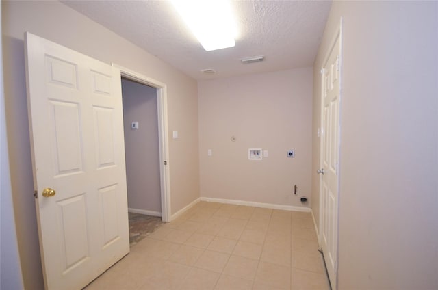 6906 Grant Dr, Magnolia, TX 77354 - washroom with electric dryer hookup, gas dryer hookup, a textured ceiling, washer hookup, and light tile patterned flooring
