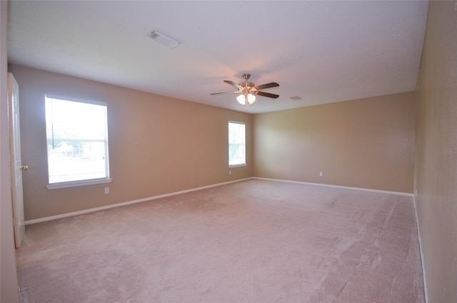 6906 Grant Dr, Magnolia, TX 77354 - empty room featuring ceiling fan and light carpet