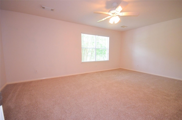 6906 Grant Dr, Magnolia, TX 77354 - spare room with light colored carpet and a ceiling fan